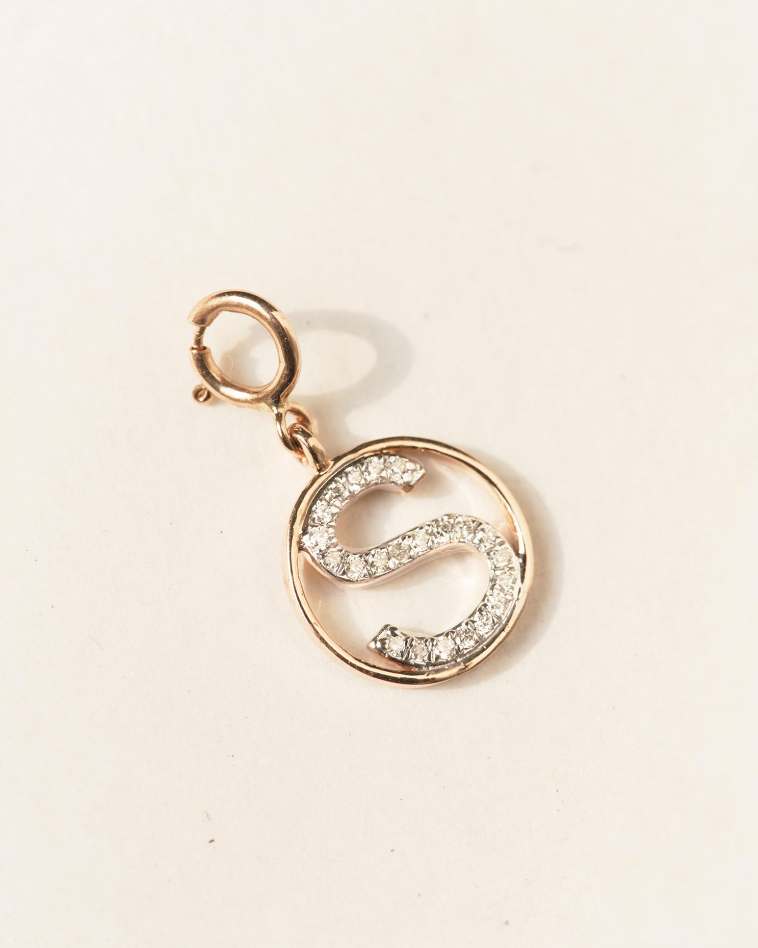 Round S charm alphabet jewellery pendant.