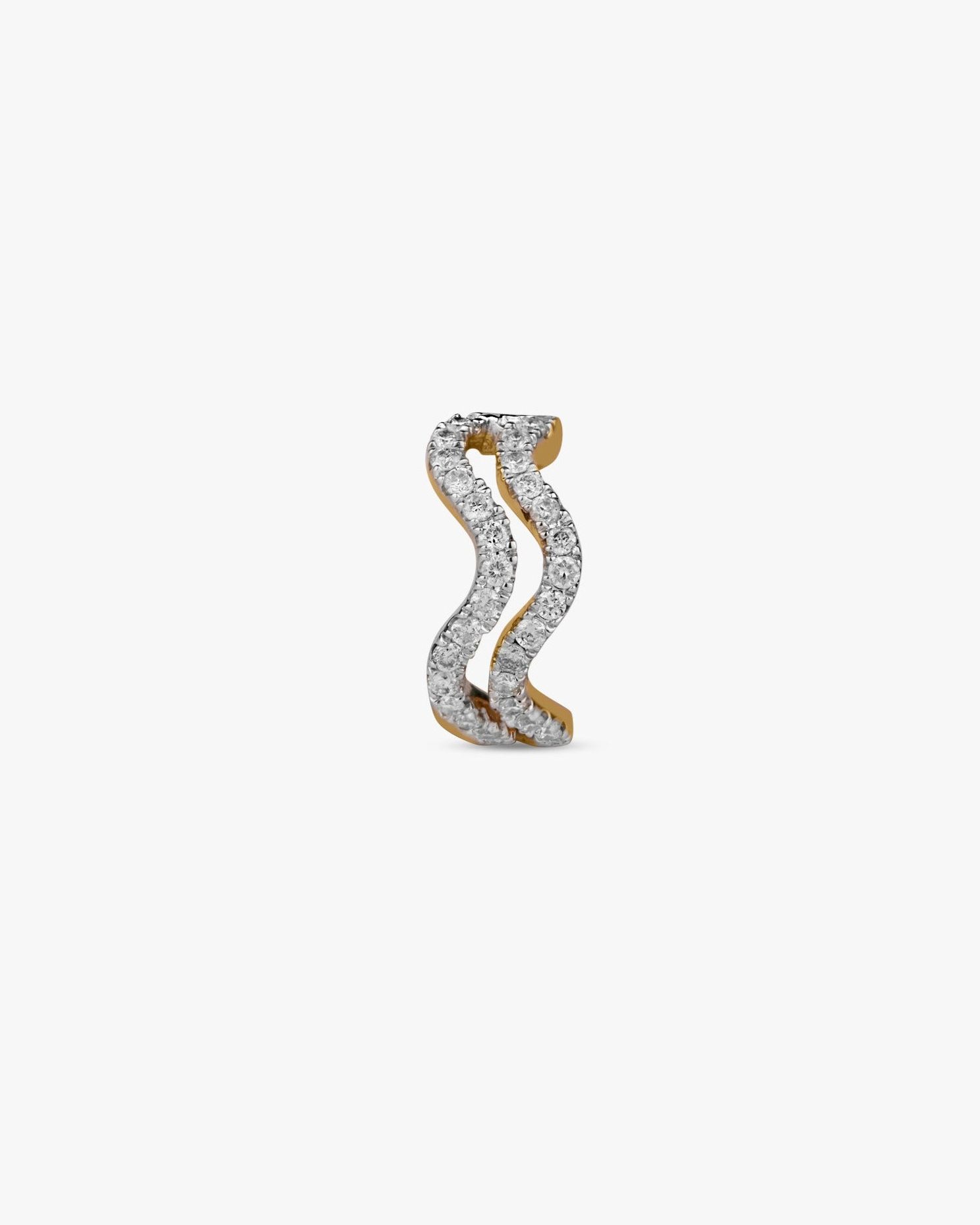 Wave-shaped gold and diamond ear climbers.