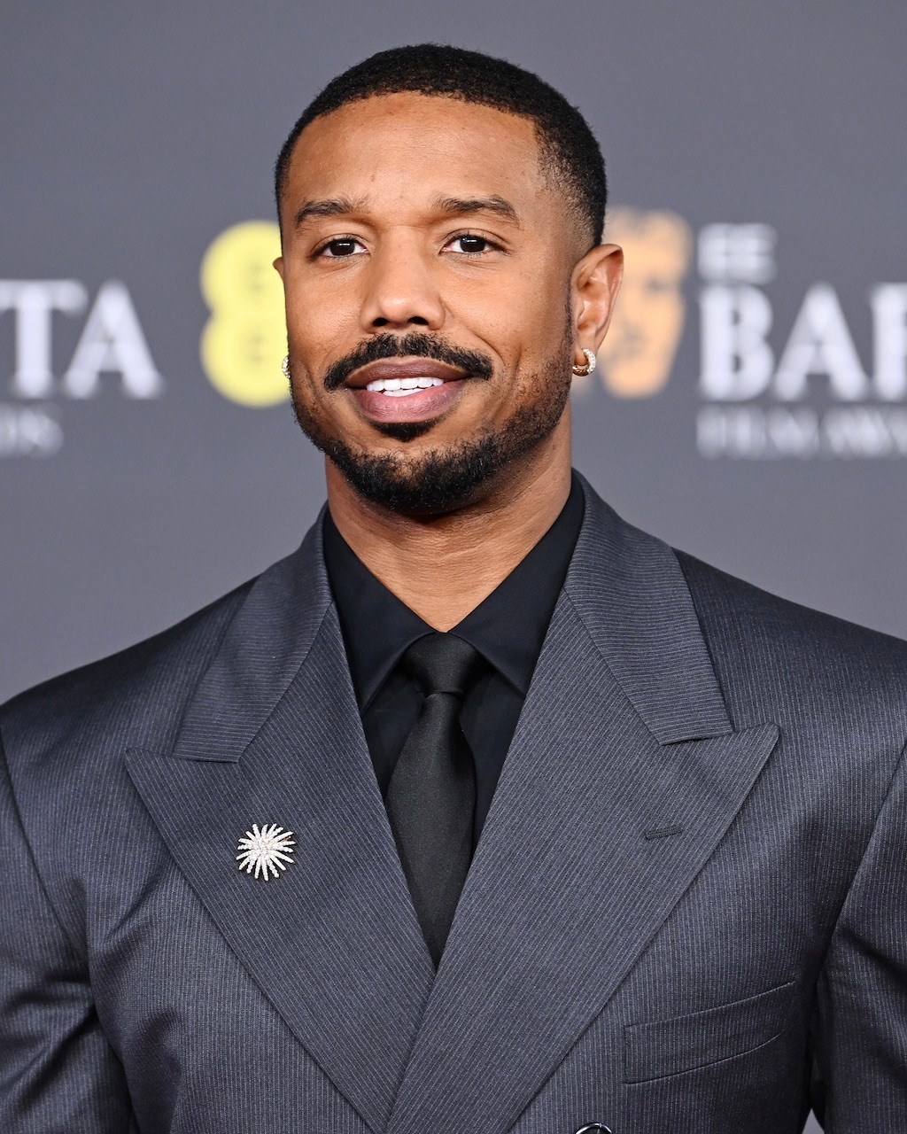Michael B. Jordan attends the BAFTA Awards 2026 in diamond jewelry