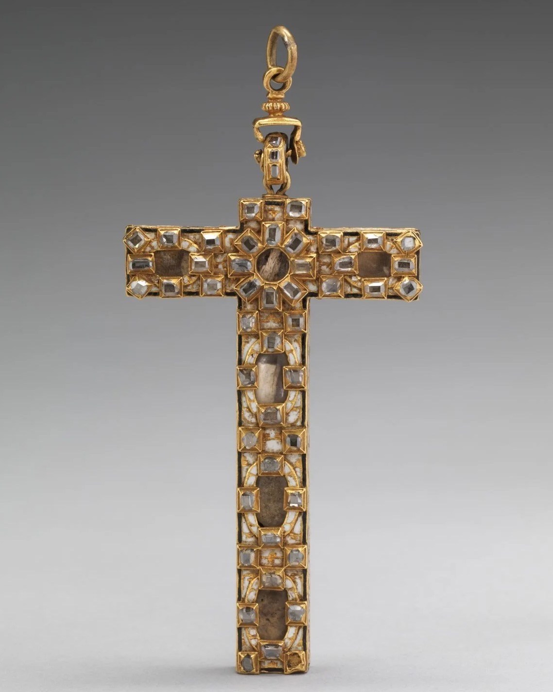 Spanish Reliquary cross and chain, rendered in gold, natural diamonds, and enamel from the early 17th century. (Gift of J. Pierpont Morgan, 1917, Metropolitan Museum of Art)