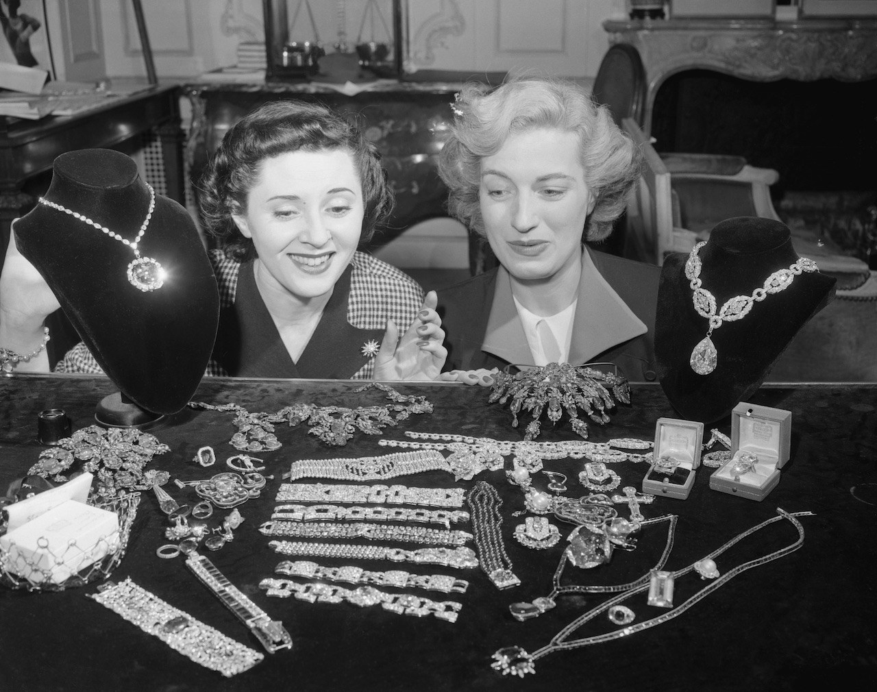Two women admire the McLean Jewel Collection at the establishment of Harry Winston, Inc. The Hope Diamond can be seen on the left, while the Star of the East diamond (worn by Nicola Peltz Beckham) can be seen on the right.