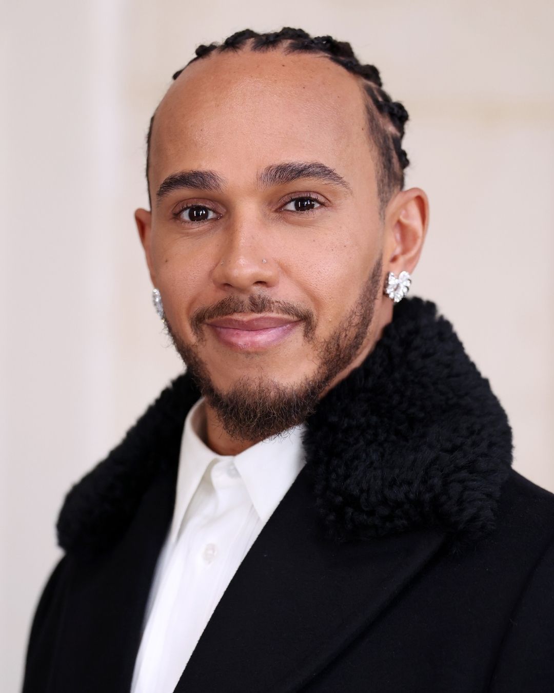 Lewis Hamilton wears diamond jewelry at Paris Fashion Week