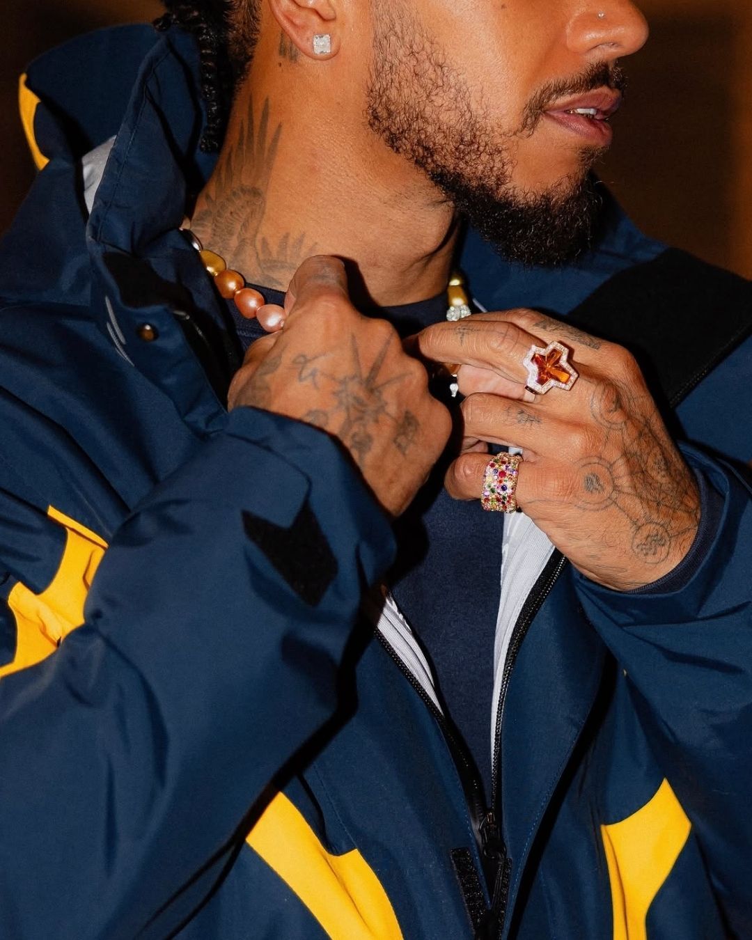 Lewis Hamilton wearing the Sex&Drugs&Rock&Roll ring from Stephen Webster. 
