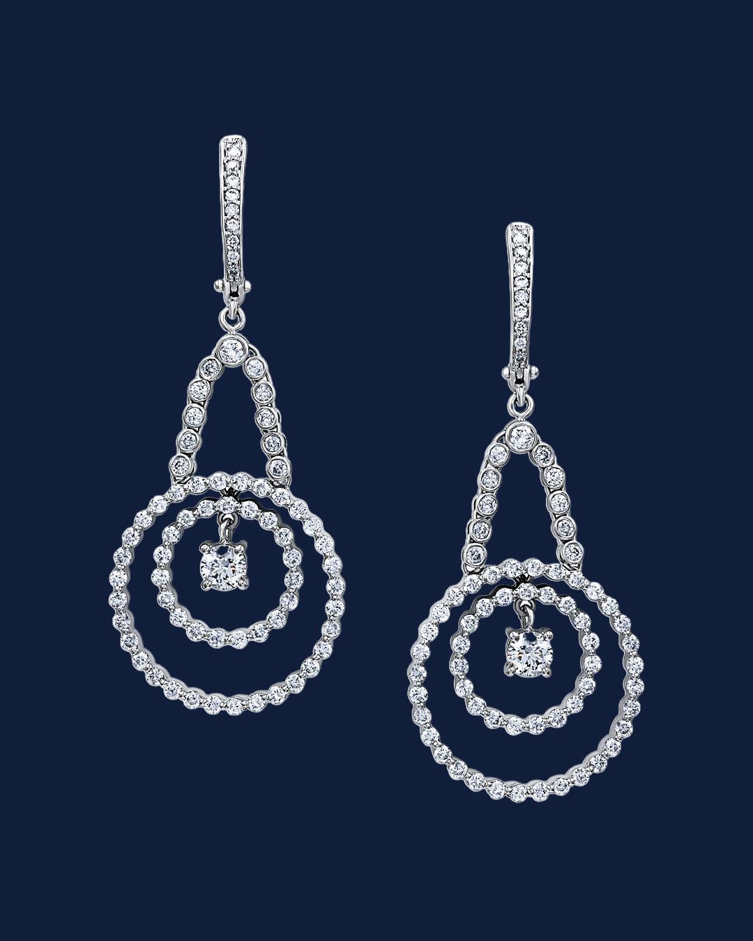 Silver double-circle drop earrings with center charm