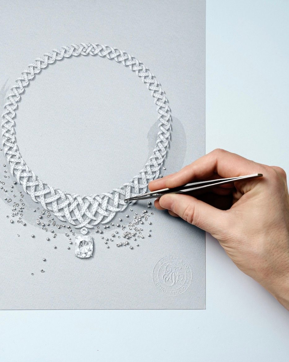 Handcrafting the Diamond Jasmine necklace from Blue Book 2026: Hidden Garden. An artisan compares diamond melee against the rendering.