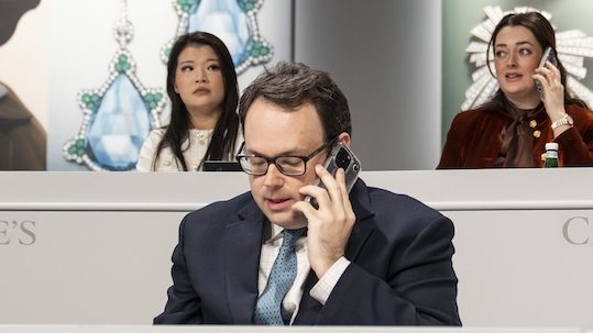 Claibourne Poindexter in the bidding booth during a Christie's Magnificent Jewels auction.