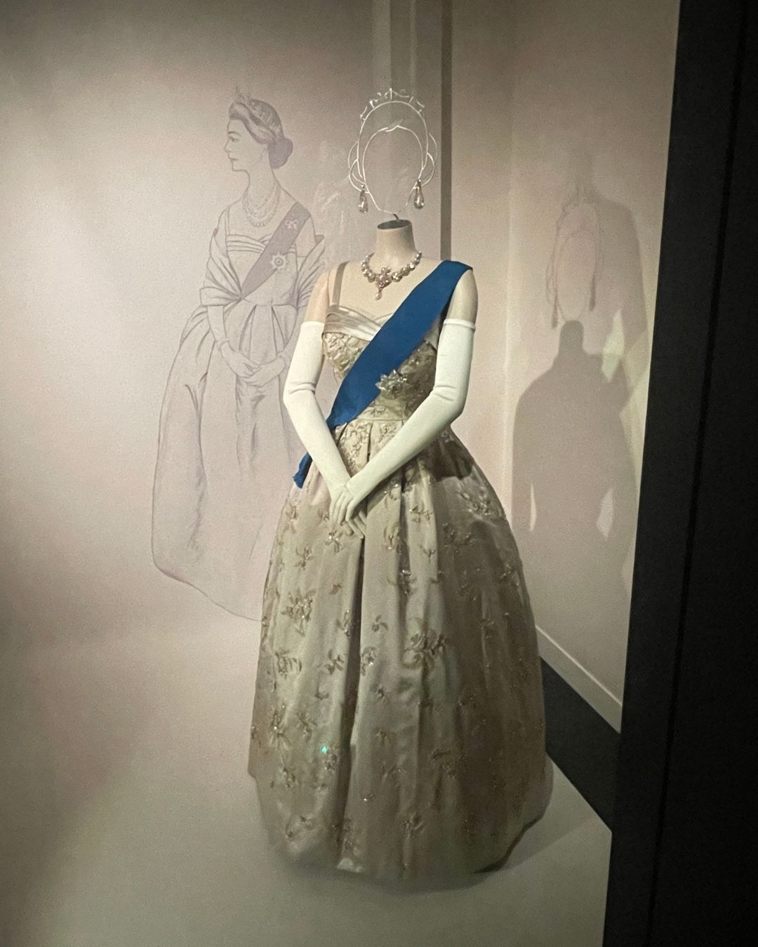 Queen Elizabeth II's gown on display at the Her Life in Style Exhibit Queen Elizabeth II: Her Life in Style