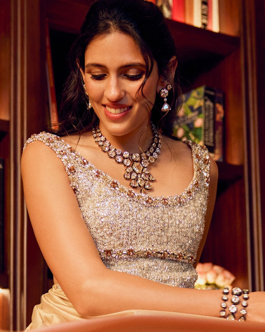 Ambani’s wearing a diamond necklace and tennis bracelet.