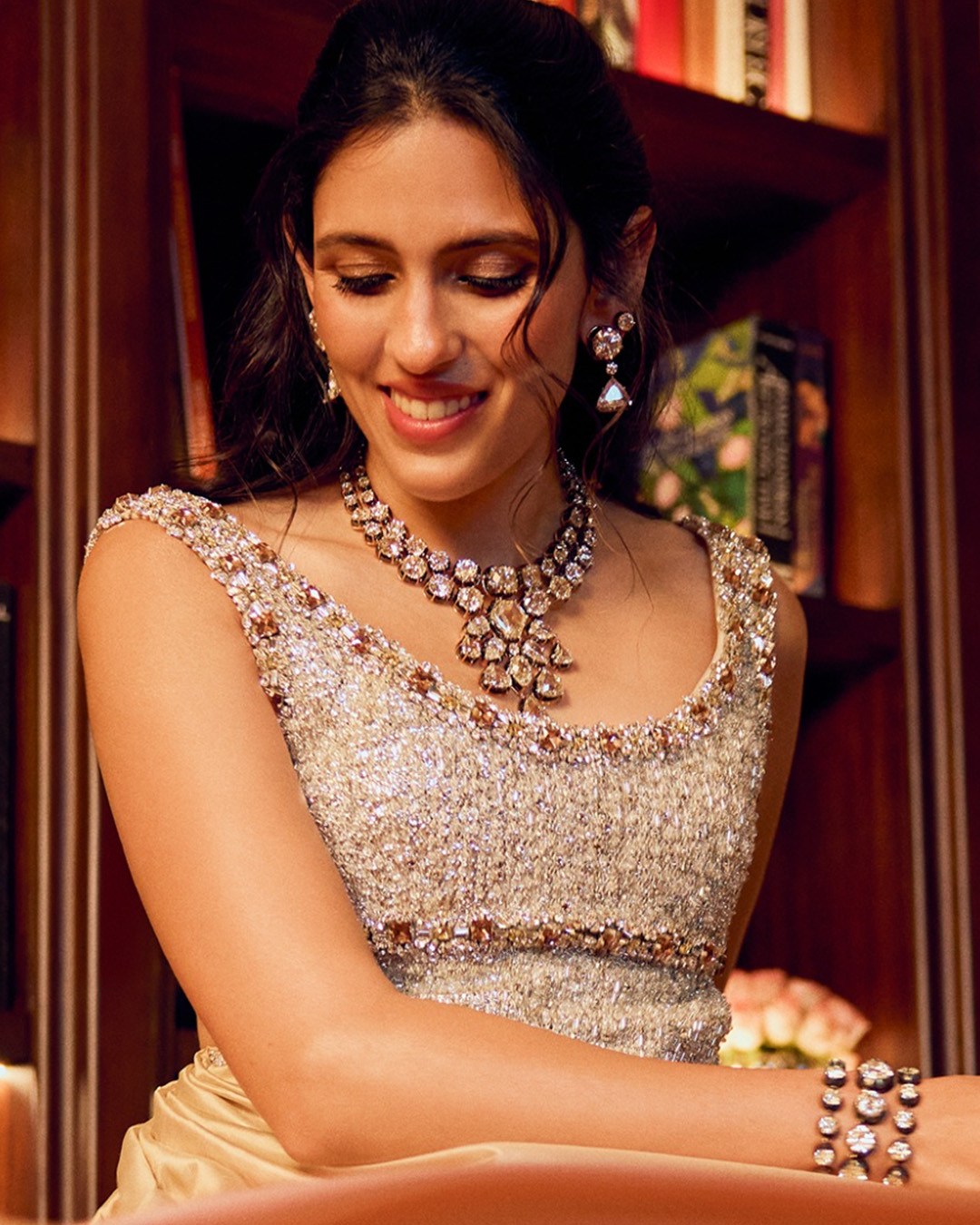 Ambani’s wearing a diamond necklace and tennis bracelet.