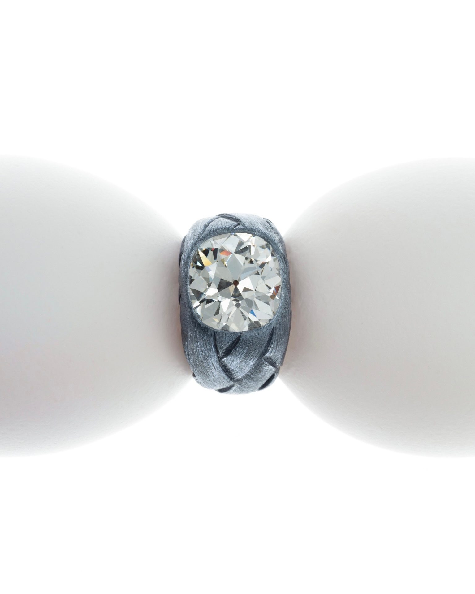 Hemmerle ring, diamond weighing over 5.7 ct., set in iron and an inner band of white gold. (Courtesy of Hemmerle)