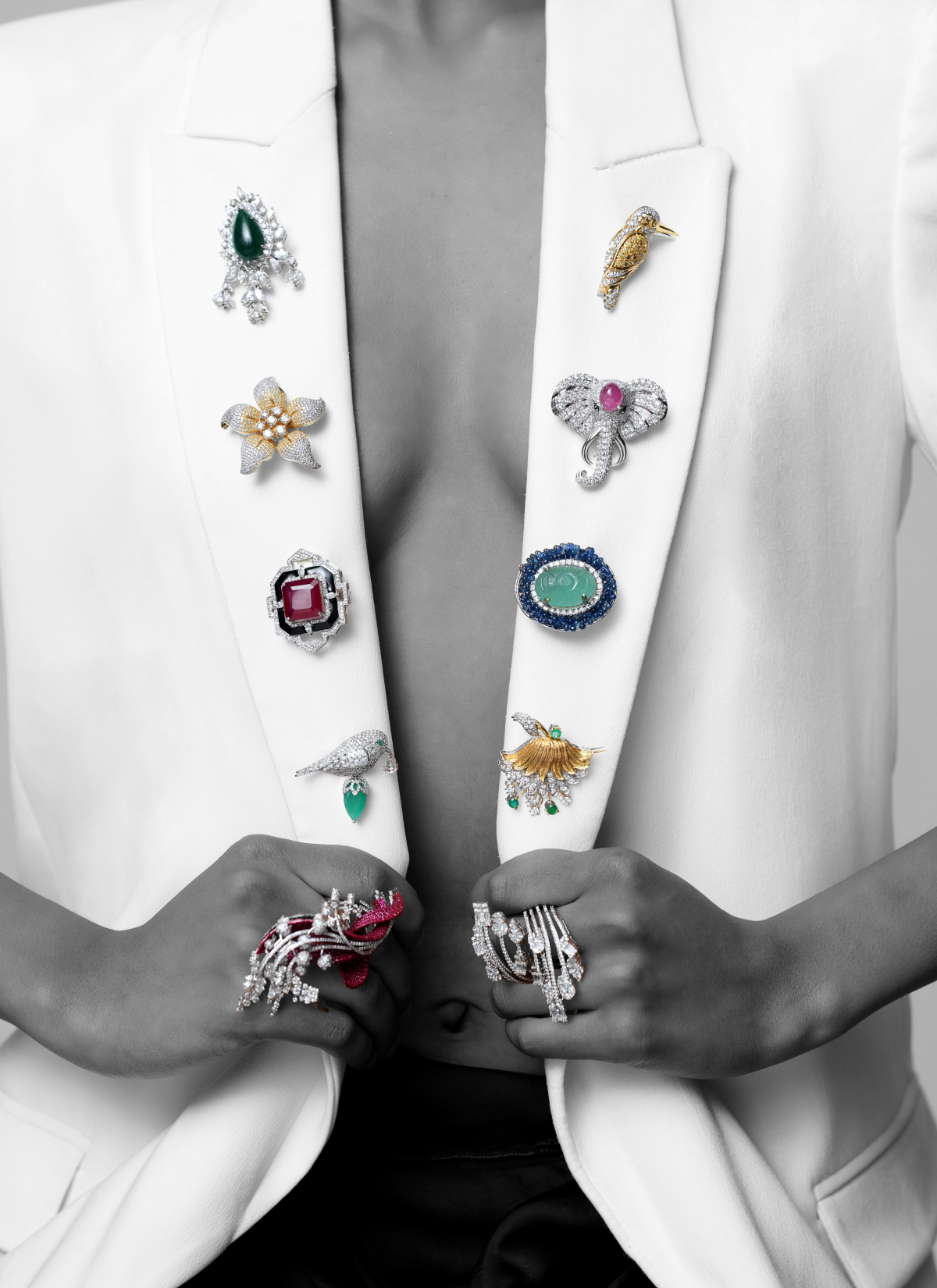 Diamond-studded brooch with statement natural diamond rings