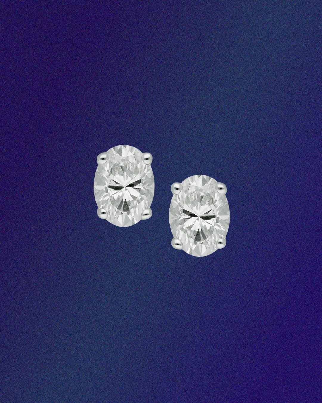 Malabar natural diamond oval stud earrings in white gold.