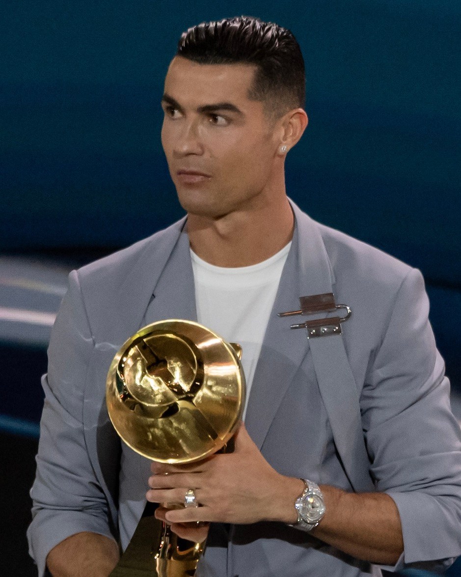 Cristiano Ronaldo receives an award during the Globe Soccer Dubai Awards 2024