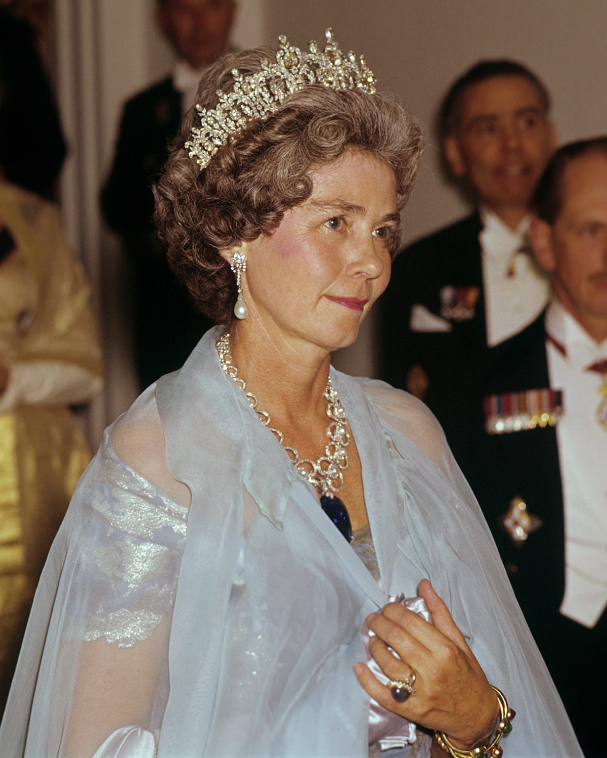 Queen Frederica of Greece attends a Greek banquet at Claridges, London, 11 July 1963 wearing a pearl diamond tiara necklace. (Photo by Fox Photos/Hulton Archive/Getty Images)