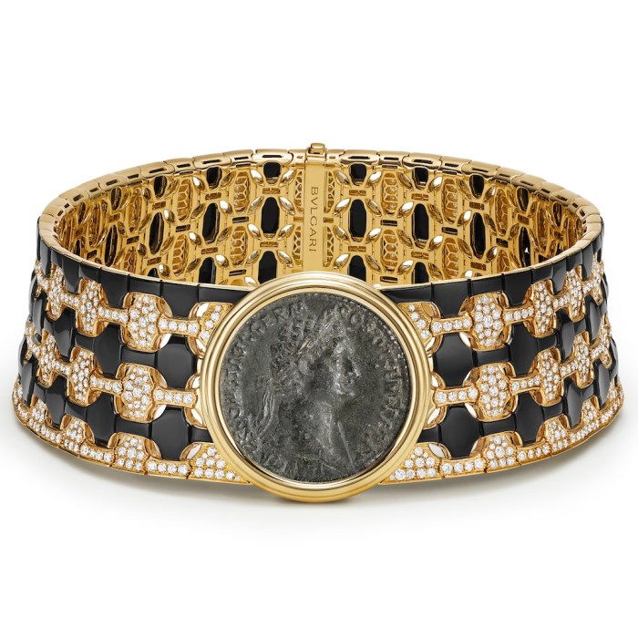 coin jewelry Bulgari High Jewelry Monete necklace in 18-karat yellow gold with onyx elements, 1 bronze coin from the Roman Empire (Domitianus Aug., A.D. 81 -96), and pavé-set diamonds.