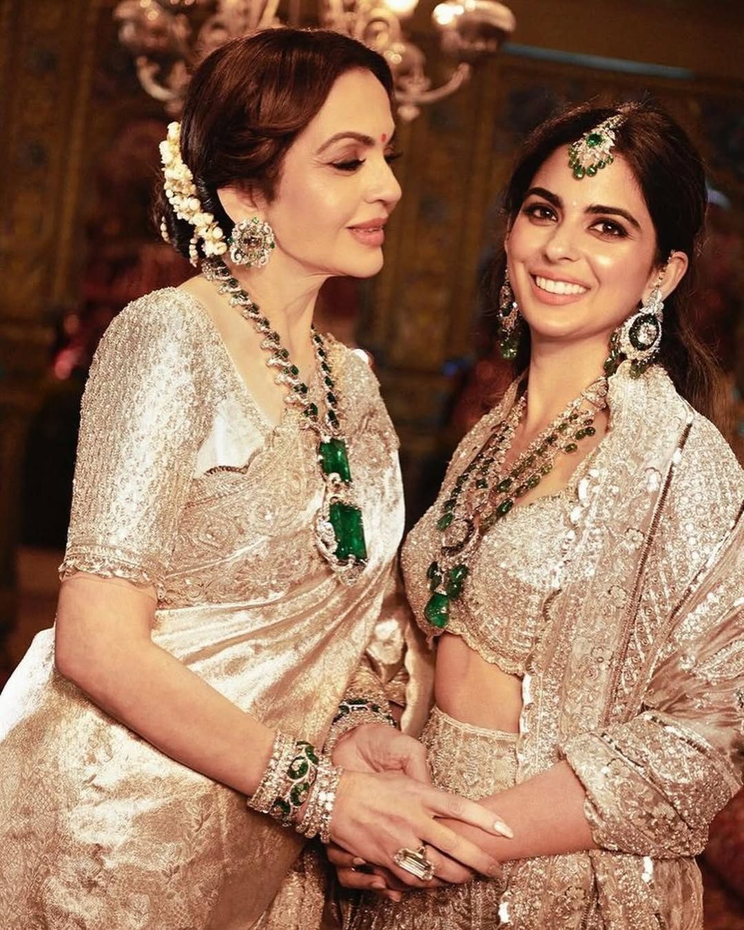 Isha Ambani in natural diamond and emerald necklace, earrings, maang tikka, and bracelet