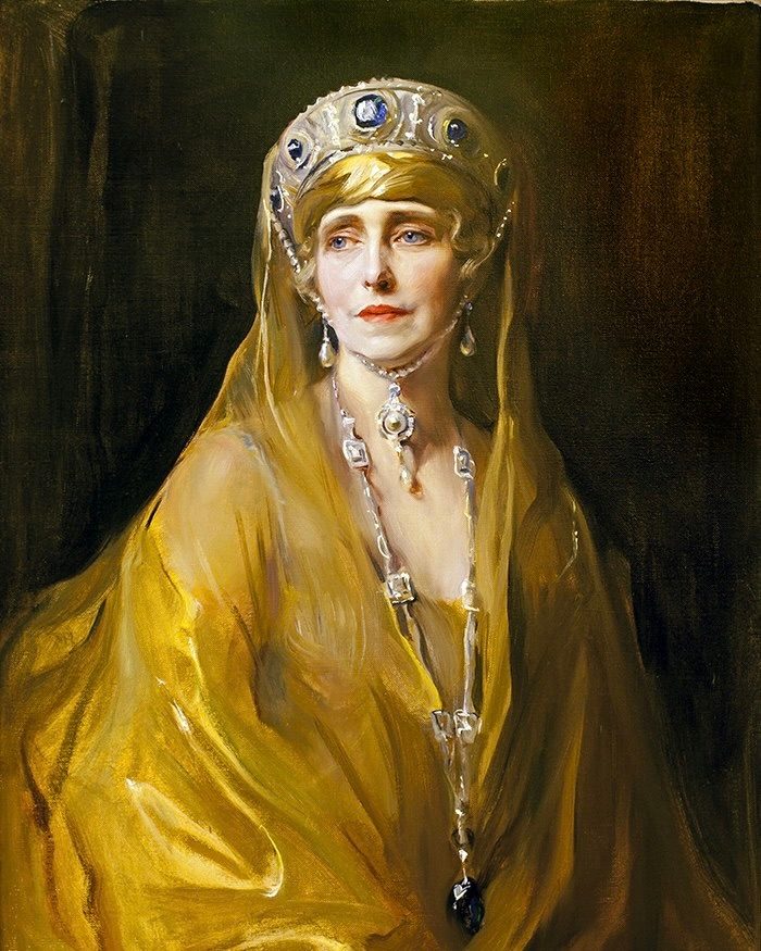 Queen Marie of Romania poses for a painting by Philip de László.